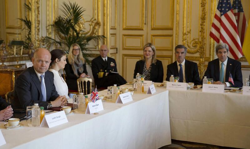 U.S. Secretary of State John Kerry, right, hosts the Budapest Memorandum Ministerial meeting at the U.S. ambassador's residence in Paris in this Wednesday March 5, 2014 file photo. U.S. Secretary of State John Kerry is in Paris where he is expected to hol