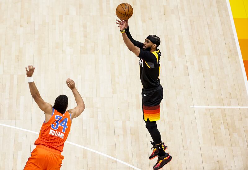 Utah Jazz guard Mike Conley shoots over Oklahoma City Thunder forward Kenrich Williams.