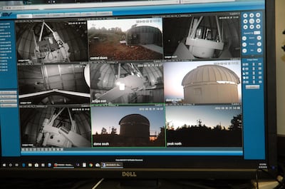 Monitor cameras inside and outside the Eccles Observatory dome keep watch. Their views are sent live to the control room in the South Physics Building at the University of Utah in Salt Lake City. The picture was taken early in the evening, before nightfal