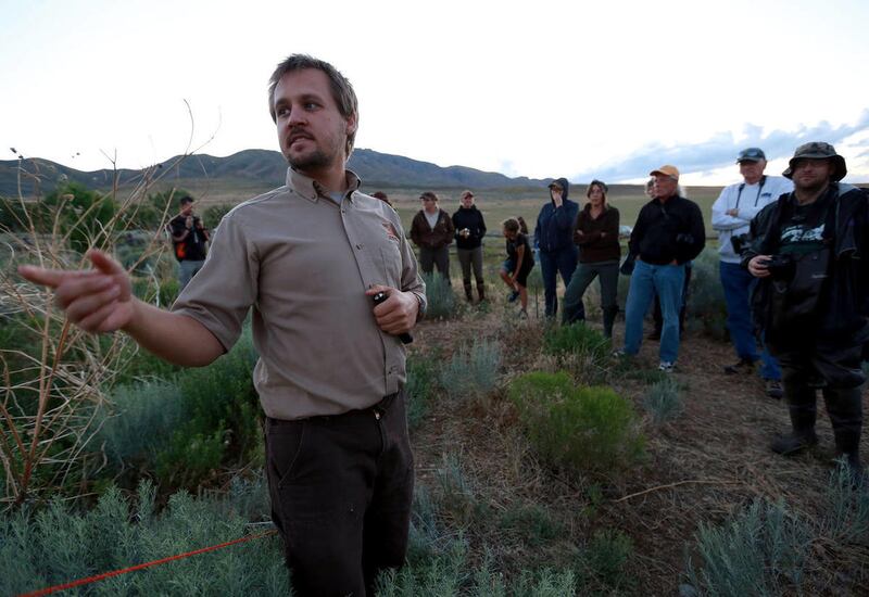 Adam Brewerton, a wildlife conservation biologist with the Division of Wildlife Resources, sets up nets to trap bats on Antelope Island on Friday, June 27, 2014.