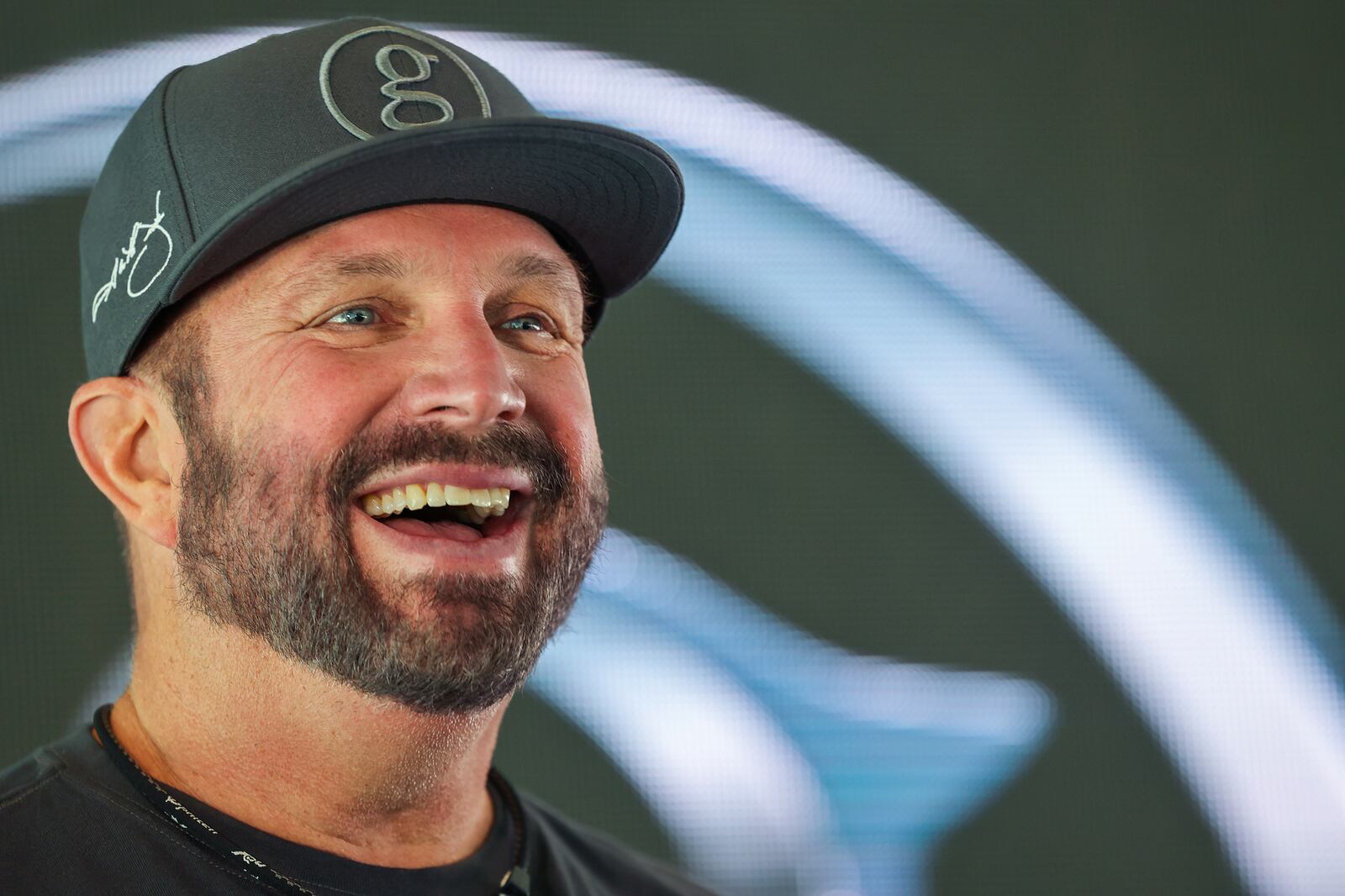 Country music superstar Garth Brooks talks with members of the media during a press conference.