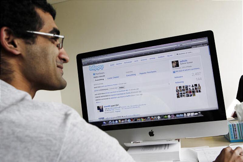 Blippy co-founder Ashvin Kumar works on his Web site, Blippy, in Palo Alto, Calif.,