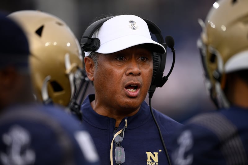 Navy head coach Ken Niumatalolo talks to players during the second half of an NCAA college football game against Memphis, Saturday, Sept. 10, 2022, in Annapolis, Md. Memphis won 37-13.