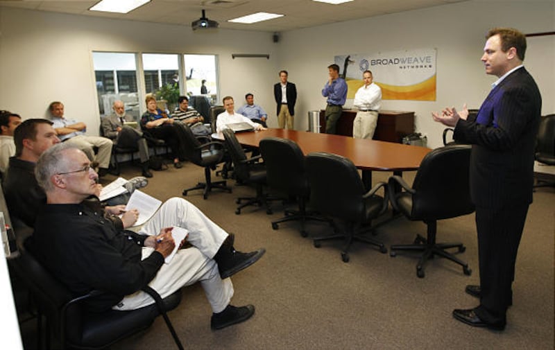 Broadweave CEO Steve Christensen, right, talks to visitors at the open house at Provo city offices, held Monday to explain the upcoming transition from iProvo to Broadweave.