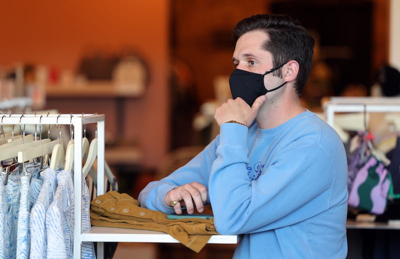 Josh Edgar, an employee at the Stockist store in Salt Lake City, talks with store owner Helen Wade and another employee, Jack Carrasco, on Sunday, April 11, 2021.