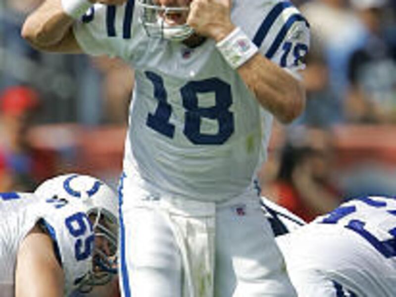 Colts quarterback Peyton Manning, above, and little brother Eli are among the NFL's best.