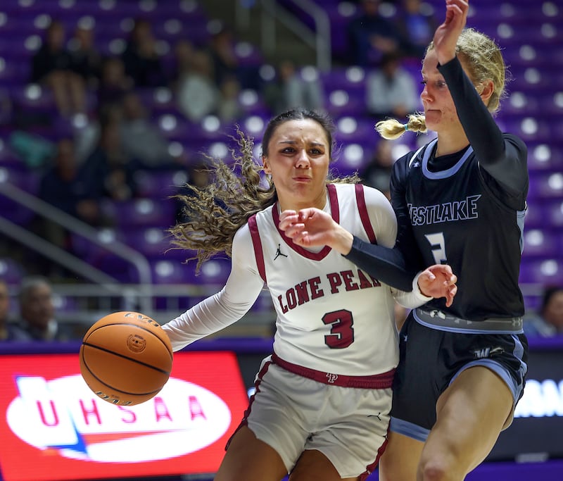 Lone Peak High School and Westlake High School compete in basketball