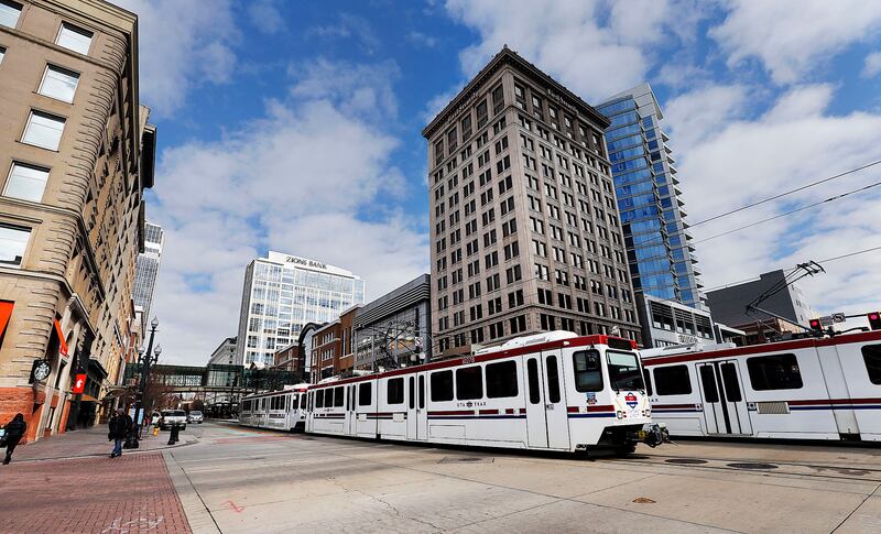 FILE - TRAX trains carry passengers through Salt Lake City on Tuesday, Jan. 23, 2018.