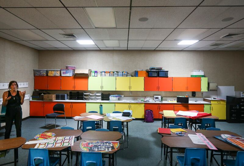 Sunlight shines through portals installed in the roof of Quinn Nicolich's, left, classroom at Granite Elementary School in Sandy on Friday, Aug. 9, 2019. The skylights allow natural light to fill classrooms that are windowless, increasing energy savings