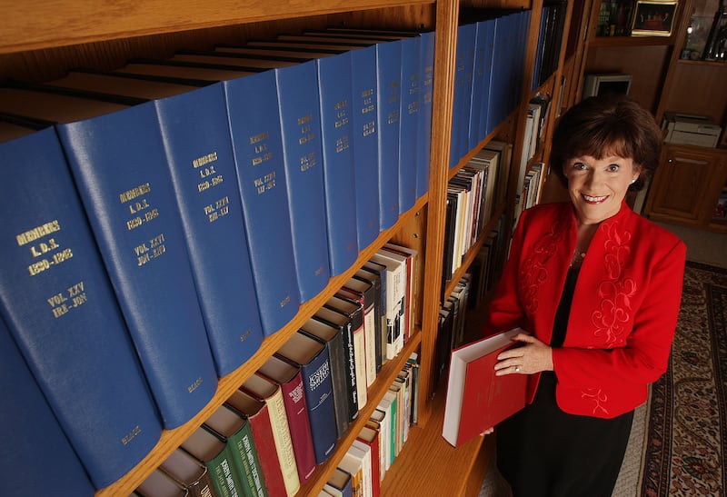 Author Susan Easton Black standing next to a bookshelf in her home in Provo, Utah.