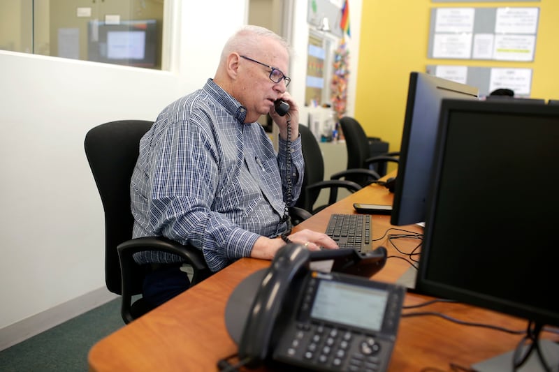 Morris Floyd, who has been volunteering at the National Runaway Safeline for 15 years speaks on the phone, Friday, March 23, 2018 in Chicago, Illinois. Floyd helps youth, teens, parents and guardians seeking help with runaway victims or victims who are th
