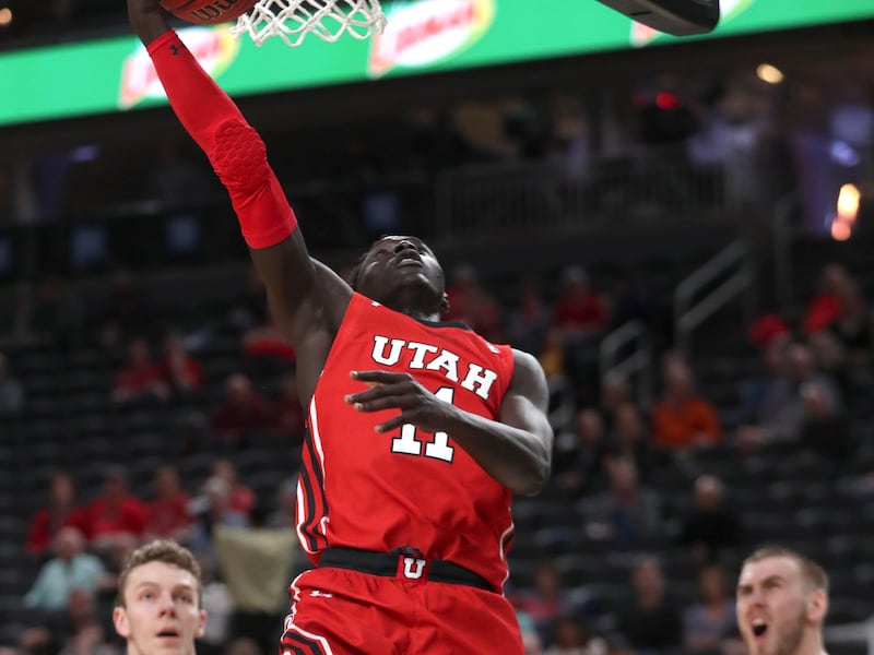 Utah Utes guard Both Gach gets to the basket for a score.