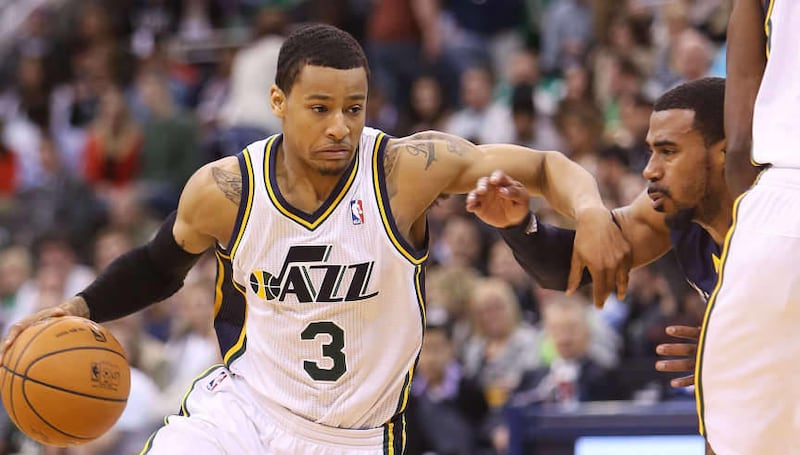 Utah Jazz's guard Trey Burke (3) works to get free of Memphis Grizzlies' guard Mike Conley (11) as the Utah Jazz and the Memphis Grizzlies play Wednesday, March 26, 2014 at EnergySolutions Arena in Salt Lake City. Memphis won 91-87