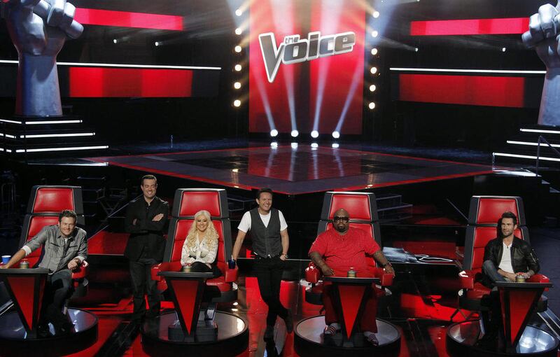 FILE - In this Oct. 28, 2011 file photo, from left, judge Blake Shelton, host Carson Daly, judge Christina Aguilera, producer Mark Burnett, judge Cee Lo Green, and judge Adam Levine, from the "The Voice", pose for photographers in Culver City, Calif. The
