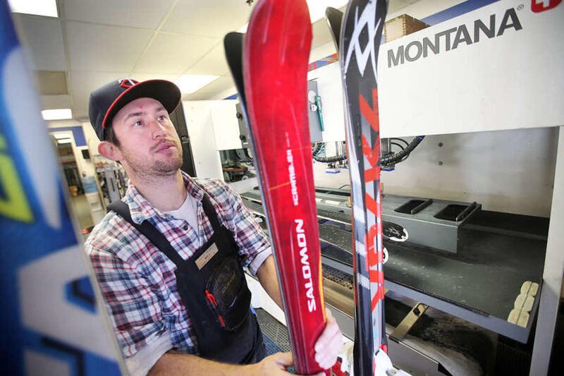 Will Huntley a crew chief at Cole Sports at Park City Mountain Resort works Monday, Oct. 27, 2014, resurfacing skis for the upcoming ski season.