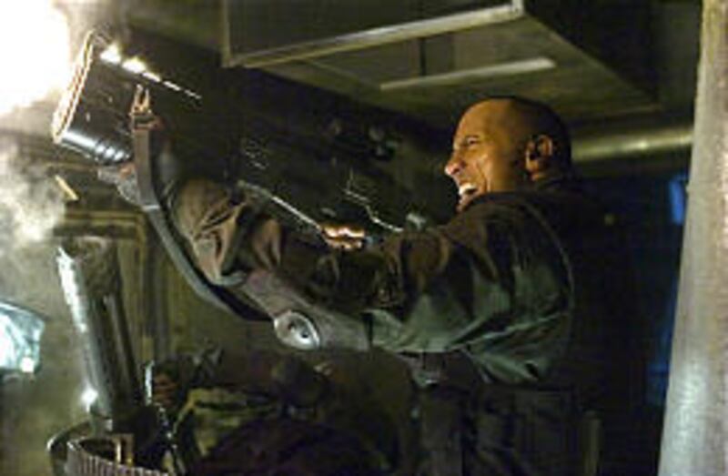 Dwayne "The Rock" Johnson battles monsters in "Doom," the movie based on the computer game.