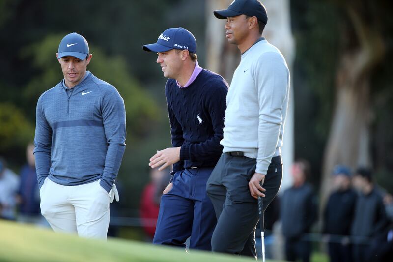 Rory McIlroy, Dustin Johnson and Tiger Woods compete in the Genesis Open golf tournament in the Pacific Palisades neighborhood of Los Angeles Thursday, Feb. 15, 2018.