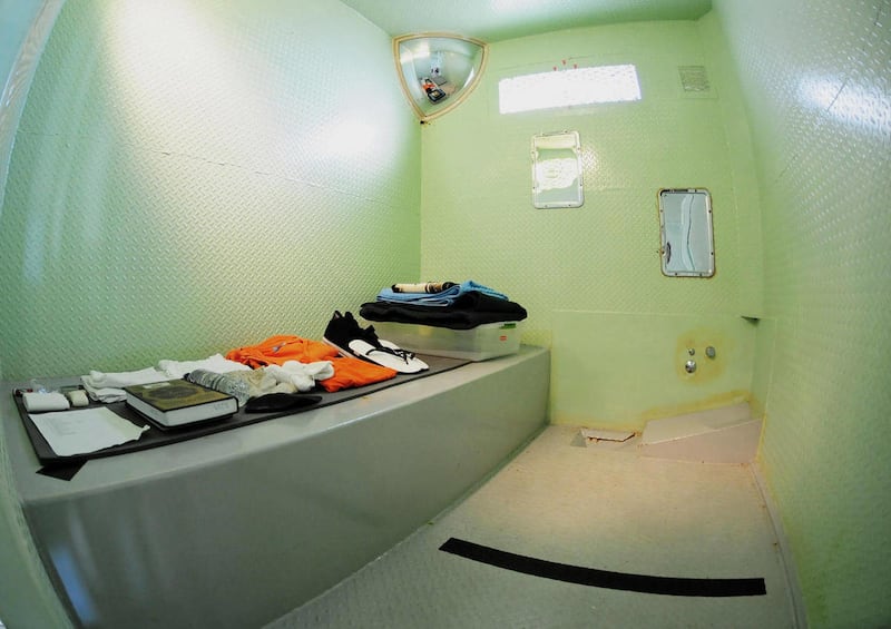 In this image released by the U.S. Military Joint Task Force Guantanamo, the interior of a cell from a disciplinary block known as Five Echo is pictured using an extreme wide-angle lens, at the detention complex at the U.S. Naval Station, Guantanamo Bay,