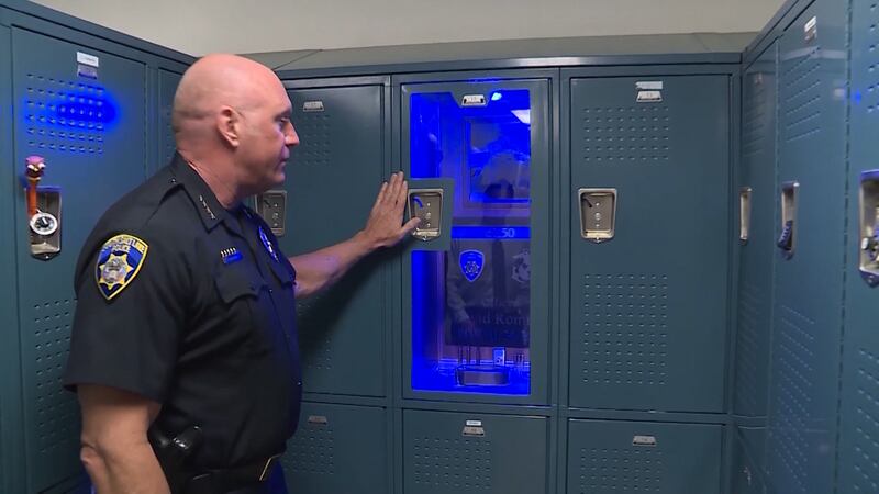 South Salt Lake Police Chief Jack Carruth shows a locker memorial for fallen officer David Romrell in South Salt Lake on April 24, 2019.