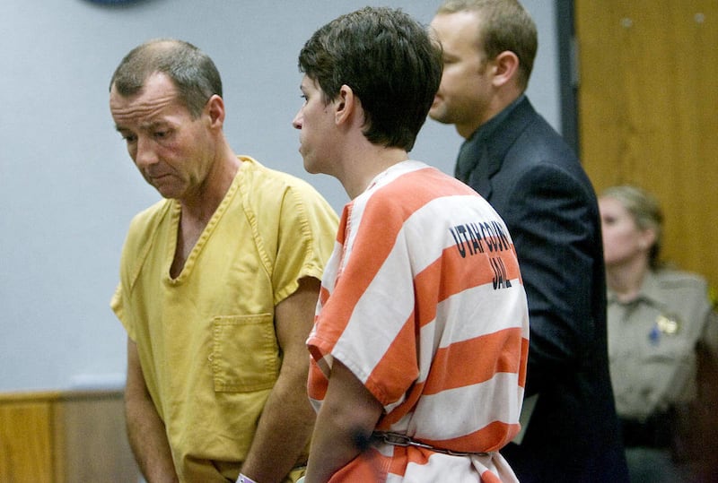 File-In this Aug. 2, 2010 file photo, Roger Kay Mortensen, 48, left, and his wife Pamela Mortensen, 34, appear in Provo's 4th District Court for a bail hearing. The son and daughter-in-law of slain university professor Kay Mortensen are suing Utah County