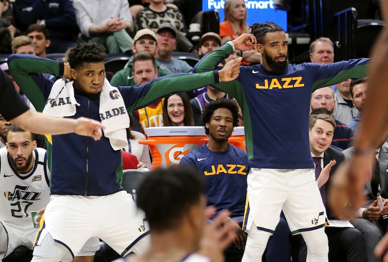 Utah Jazz guards Donovan Mitchell and Mike Conley help referees with call during game against Sacramento on Jan. 18, 2020.
