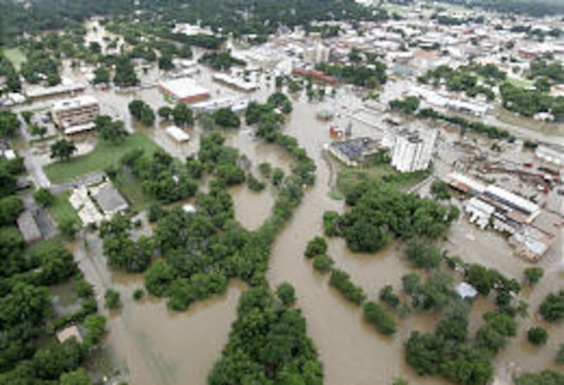 Waters flood downtown Gainesville, Texas, Monday. Up to eight inches of rain fell in parts of north Texas since midnight.