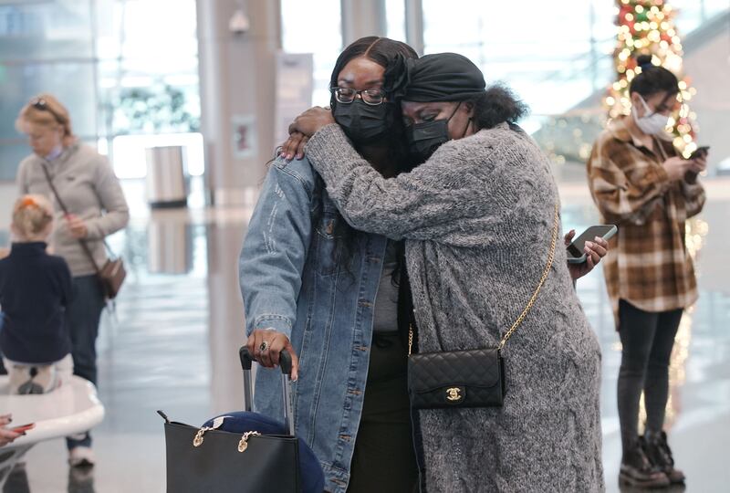 Monica Annoh gets a hug from her mother Eunice Lamptey before her departure at Salt Lake City International Airport.