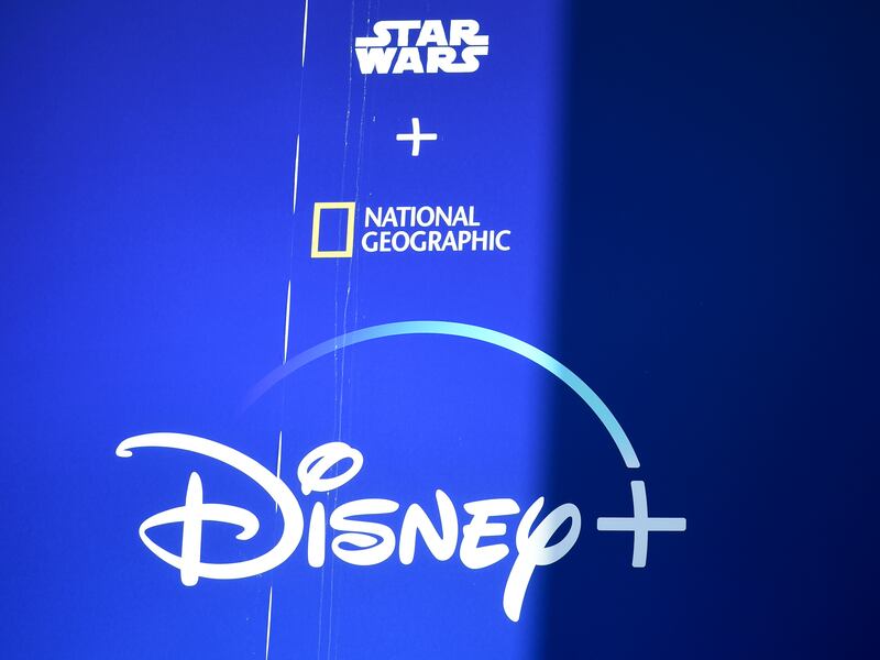 A Disney+ advertisement hangs above the El Capitan Theatre, Monday, May 4, 2020, in Los Angeles. (AP Photo/Chris Pizzello)
