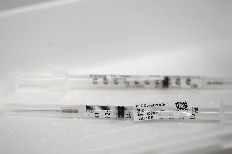 Syringes containing the Pfizer-BioNTech COVID-19 vaccine, are shown before being administered, Monday, Jan. 4, 2021, at Jackson Memorial Hospital in Miami.