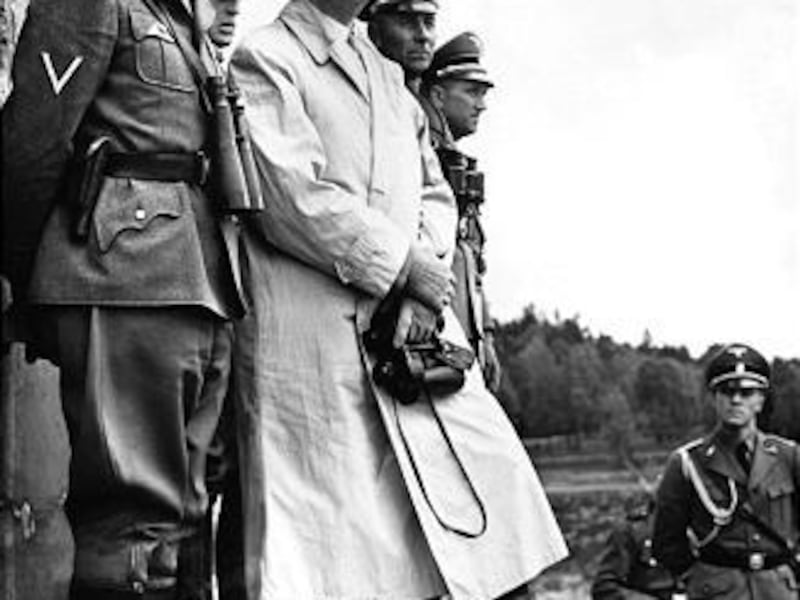 Heinrich Himmler, head of the Gestapo, stands next to Adolf Hitler in this 1940 photo from CIA.