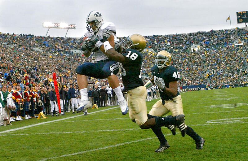 BYU's Jonny Harline makes a touchdown catch against Notre Dame's Chinedum Ndukwe as Brigham Young University losses to Notre Dame 49-23 in  football in South Bend, Indiana, Oct. 22, 2005.  Photo by Tom Smart