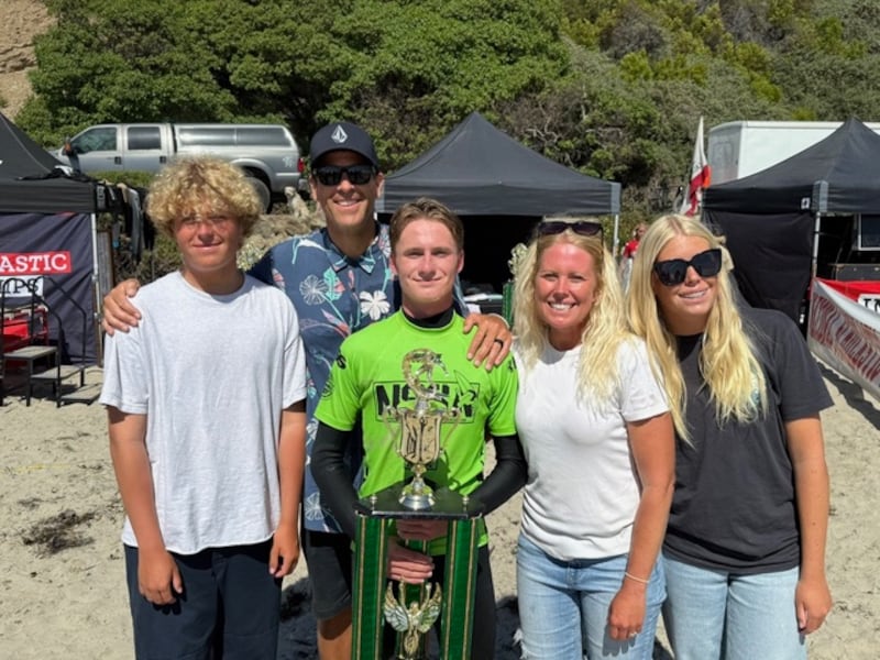 Saxon Baltzer poses with hisnational championship trophy with members of his family. From the left to the right: Dane Baltzer, Tad Baltzer, Saxon Baltzer, Amber Baltzer and sister Kylie Baltzer .