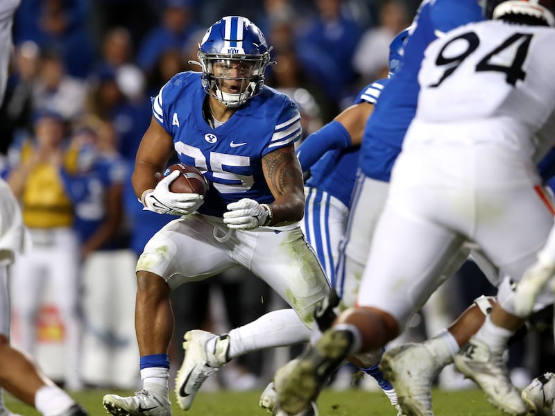 BYU running back Tyler Allgeier looks for an opening during game against Virginia at LaVell Edwards Stadium in Provo.