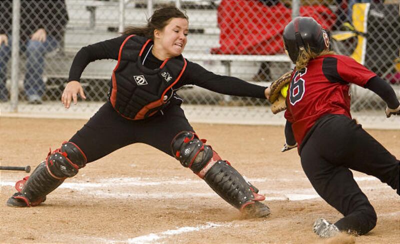 Roy's Jessyca Fullmer stretches to tag Viewmont's Cina Cummings out at home plate as the Royals beat the Vikings.