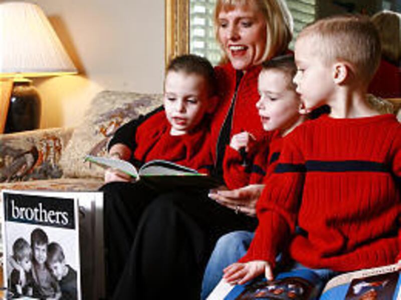 Shana Davis, with sons Bennett, left, Carter and Keenan, is an independent consultant for Heritage Makers, based in Provo.