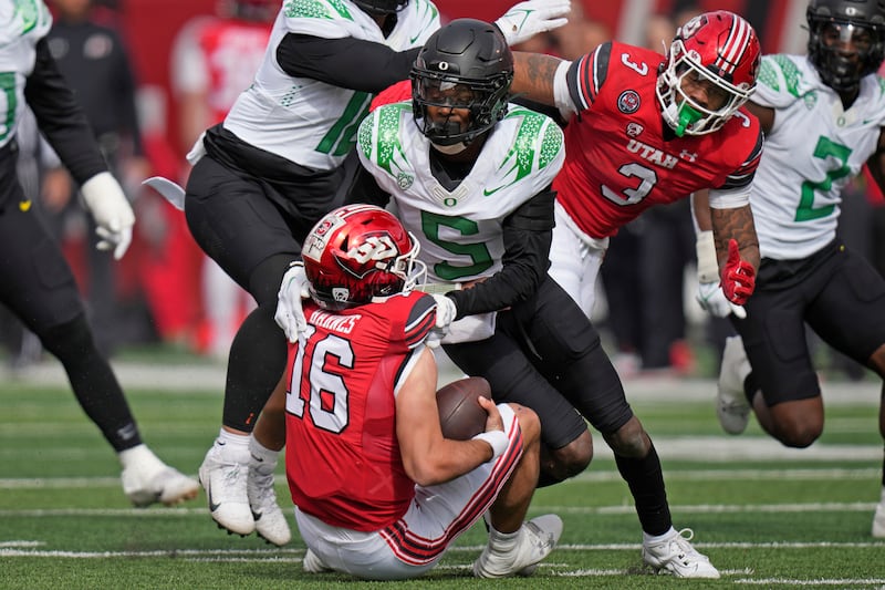 Oregon defensive back Khyree Jackson sacks Utah QB Bryson Barnes during a game Saturday, Oct. 28, 2023, in Salt Lake City.