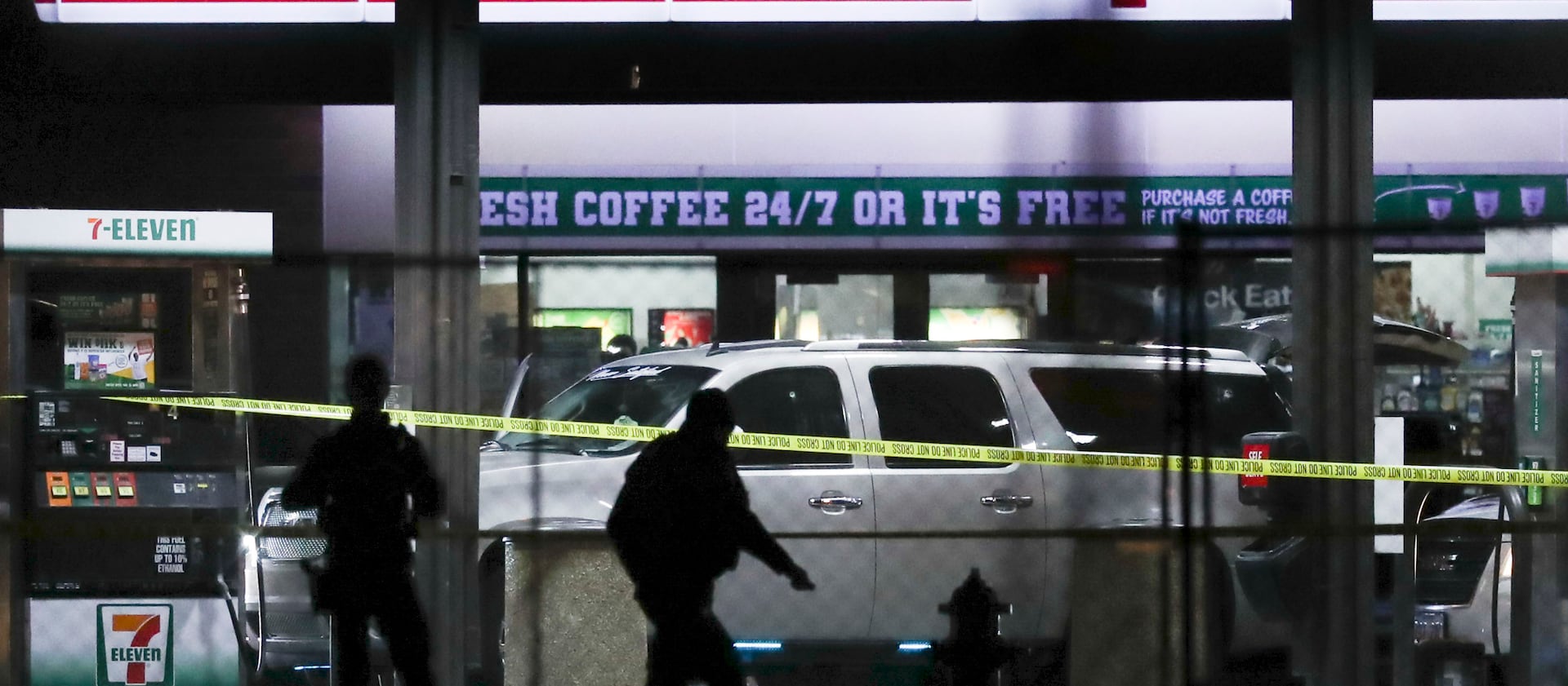Crime tape and a heavy police presence surround a 7-11 in Taylorsville on Wednesday, Dec. 1, 2021.