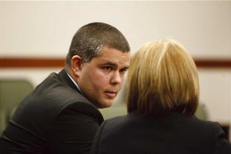 Ken Hammond, left, the former police officer credited with saving lives at Trolley Square, confers with attorney Brenda Beaton in 2nd District Court.