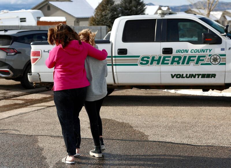 Community members near a home where eight members of a family were killed in Enoch, Iron County, on Thursday, Jan. 5, 2023.