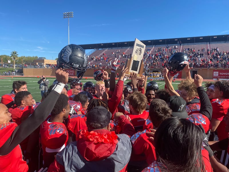 Layton Christian players celebrate winning the 1A state championship at Utah Tech University in St. George on Friday, Nov. 11, 2022.