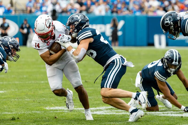 BYU Cougars safety Ethan Slade tackles SUU receiver Zack Mitchell at LaVell Edwards Stadium in Provo, Sept. 9, 2023.