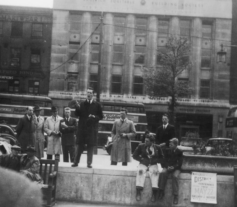 Young Elder Russell Ballard preaches at a street meeting in Nottingham Square, England, in May 1949.