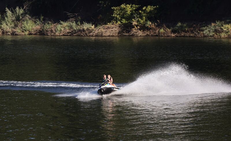 People jetski on Pineview Reservoir in Weber County on Monday. Utah's reservoir system remains at about 81% capacity entering this week.