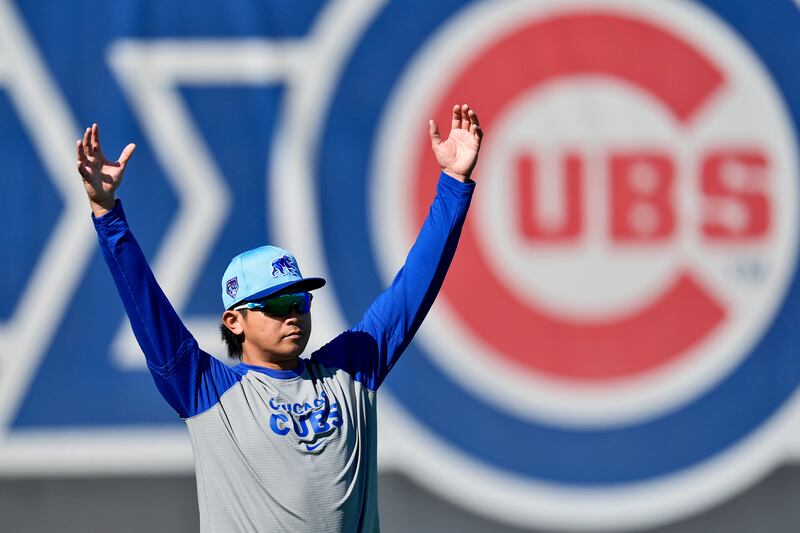 Chicago Cubs pitcher Shota Imanaga stretches during a baseball spring training workout, Feb. 17, 2024, in Mesa, Ariz.