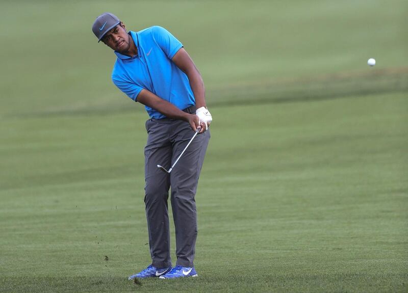 Tony Finau chips the ball to the green on the fifth hole during the second round of the Arnold Palmer Invitational golf tournament in Orlando, Fla., Friday, March 18, 2016. (AP Photo/Willie J. Allen, Jr.)