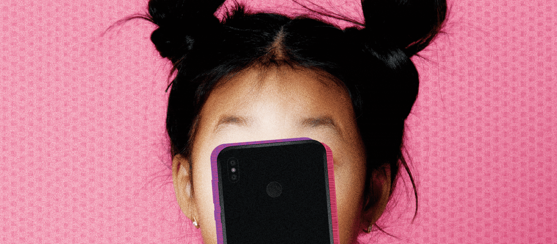 A young “zoomer” of the Gen Z generation is completely absorbed with their smartphone.
