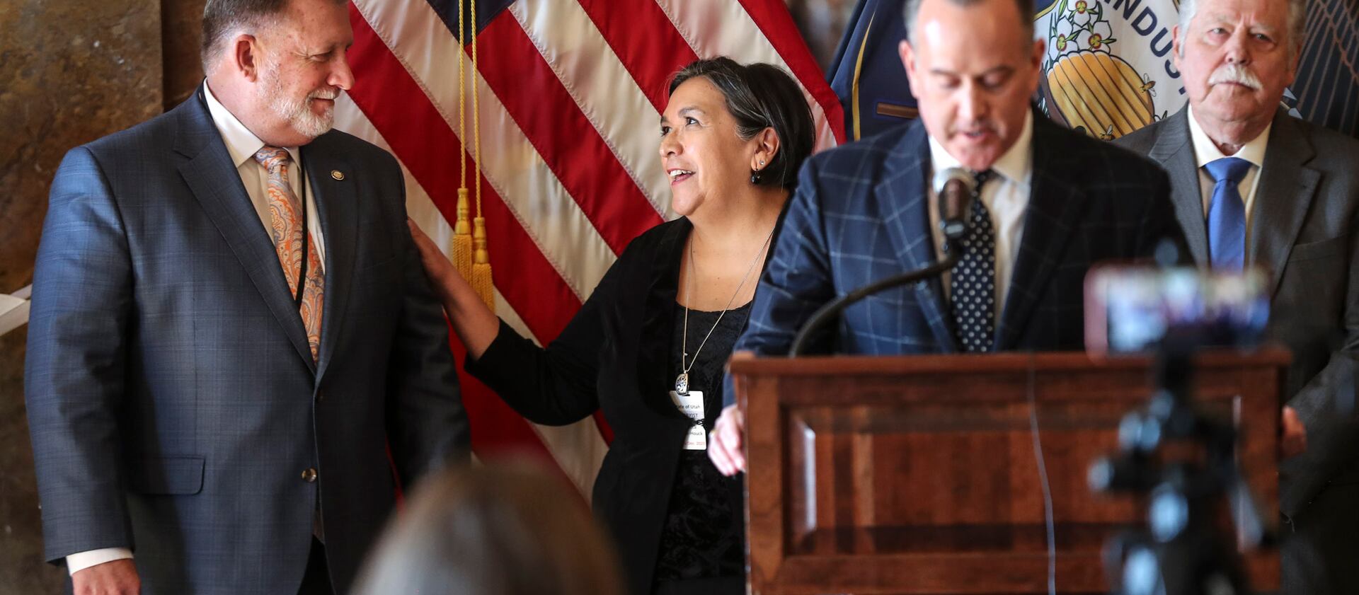 Sen. Curt Bramble, R-Provo, left, and Rebecca Chavez Houck, executive director for Better Boundaries, smile as Jeff Wright, co-chairman of Better Boundaries, discusses a deal over Proposition 4.