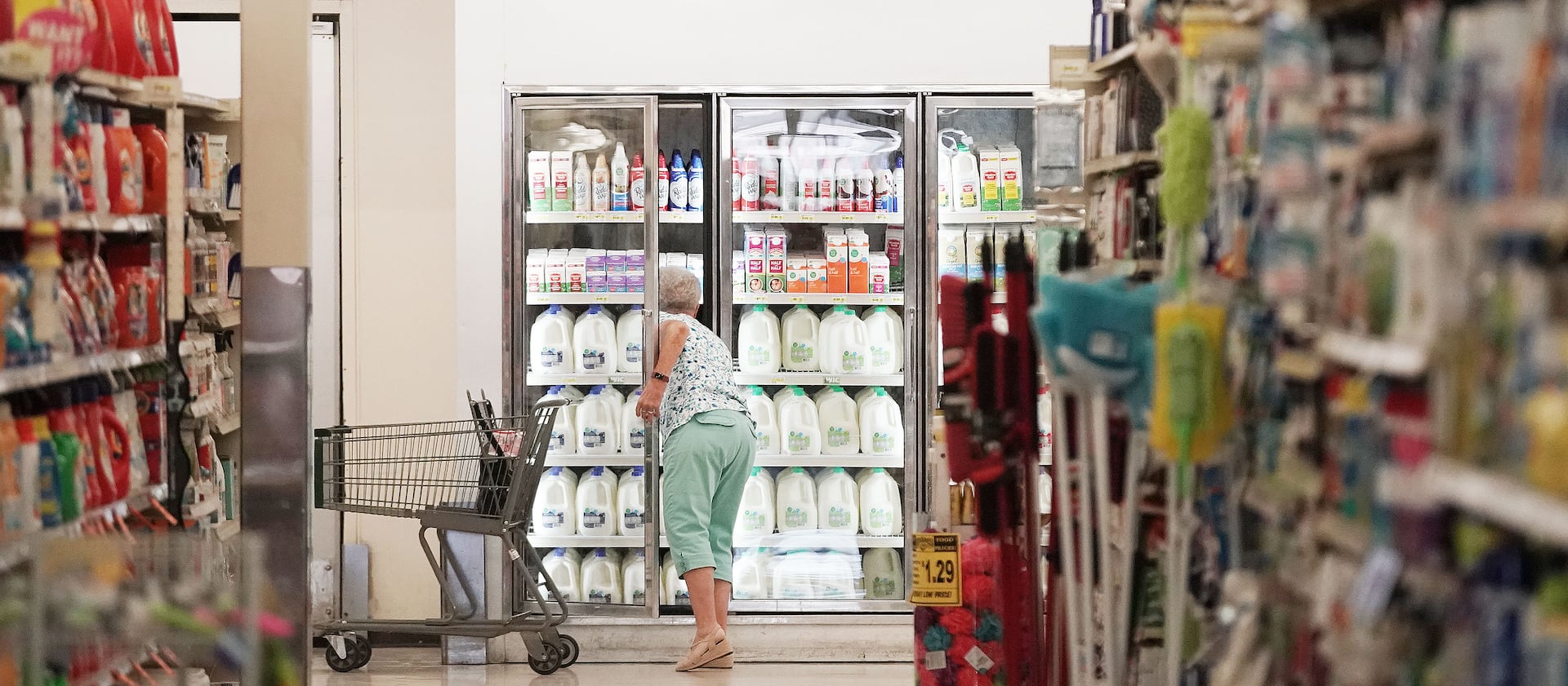 A shopper looks at milk at Reams in Sandy last July.