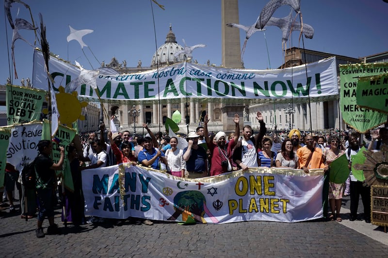 Climate change activists march in St. Peter’s Square in June 2015.