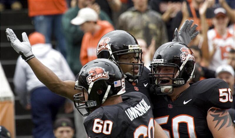 Oregon State running back Jacquizz Rodgers, middle, celebrates his touchdown with teammates Alex Linnenkohl,left, and Mike Remmers against Portland State in Corvallis, Ore., Saturday.